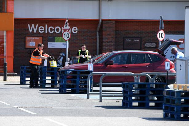 Staff at Grimsby's B&Q Extra store in bring goods, leave them on pallets and let customers pick them up and carry to their cars in the new Click and Collect system in the car park, whilst adhering to government social distancing guidelines